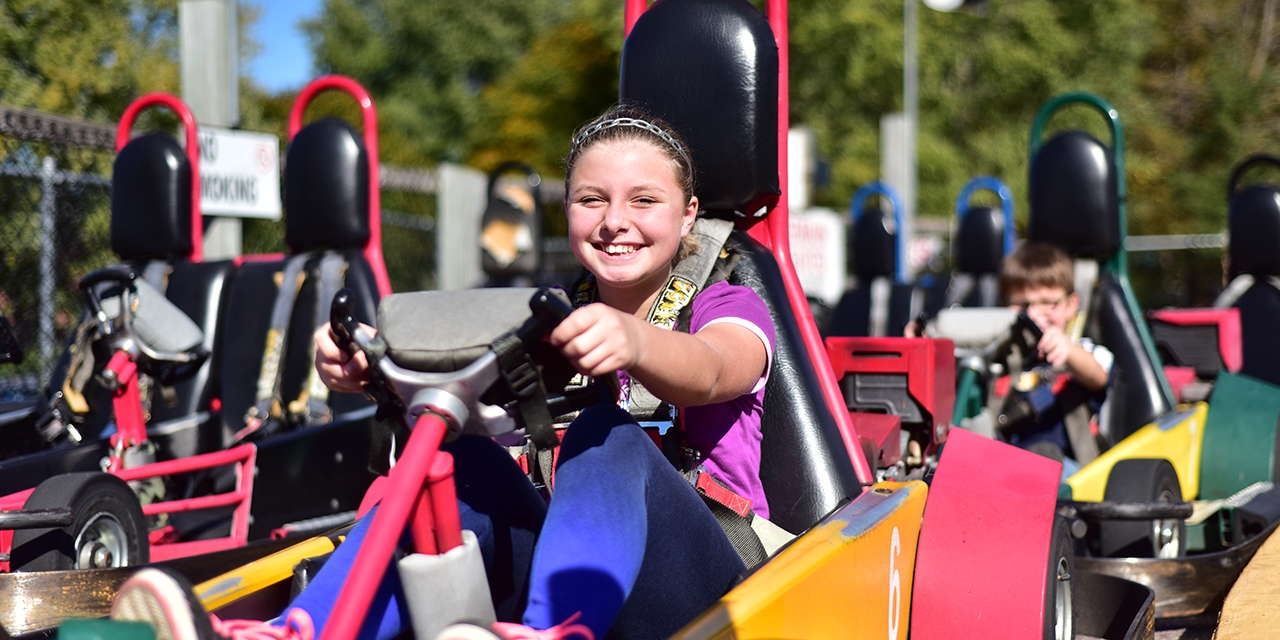 People riding go-carts.