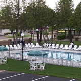Outdoor pool with poolside seats.
