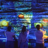People playing with interactive lights display.