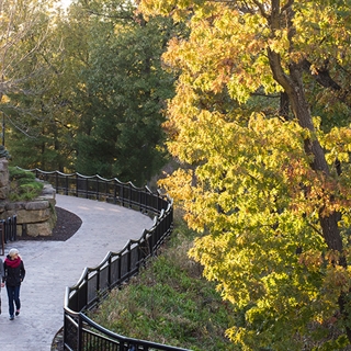 People walking on the Scenic River Walk in Downtown Wisconsin Dells.