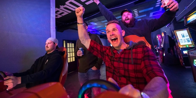 People playing Arcade games at Asgard Underworld Arcade.