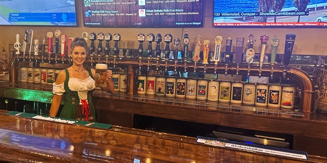 Bartender standing behind the bar.