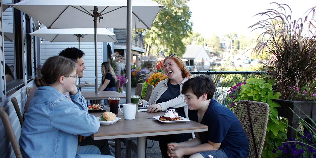 People outside at Bella Goose- Cafe on the River