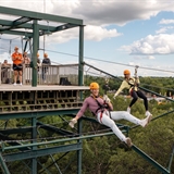 People ziplining.