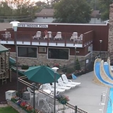 Rooftop patio, playground, and outdoor pool area.