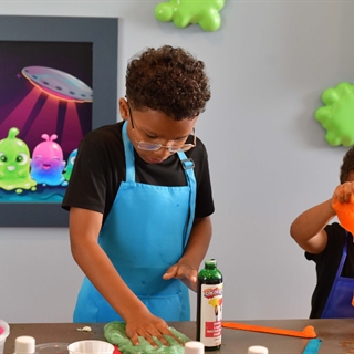 Kids playing with slime at Booby Trap Escape Rooms.