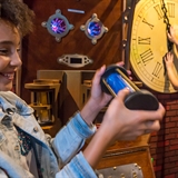 Kids examine different puzzle objects.