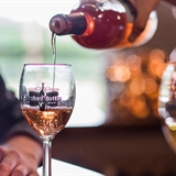 Wine being poured into a wine glass.