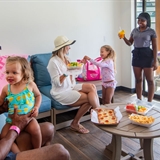 Family eating inside a waterpark cabana.