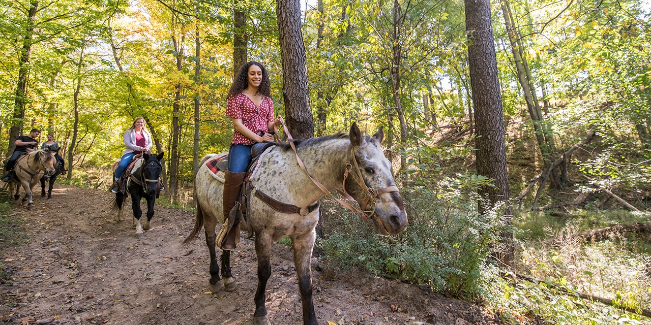 People riding horses at Canyon Creek Riding Stables.