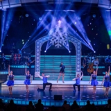 Musical Christmas scene on stage.