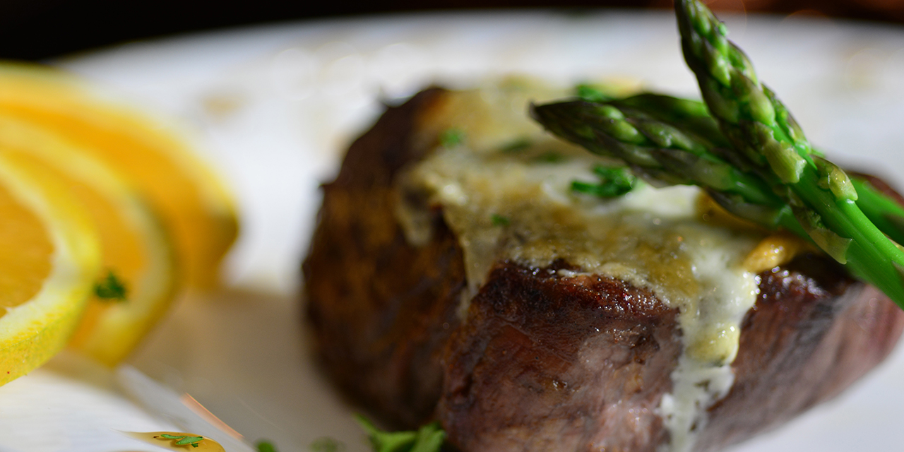 Large plated steak and asparagus.