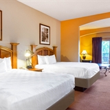 Two-bed bedroom with television.