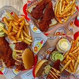 Chicken tenders, sliders, and french fries.