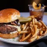 Burger, fries, and a an old fashioned cocktail.