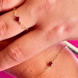 Ring and bracelet with red stones.