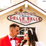Married couple in front of a chapel.