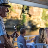 A man playing guitar.