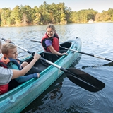 A family kayaks in Wisconsin Dells.
