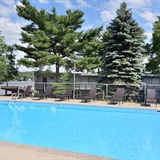 Outdoor pool with a lake view.