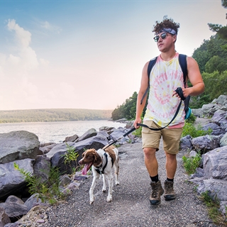 Guy walking a dog at Devil's Lake State Park