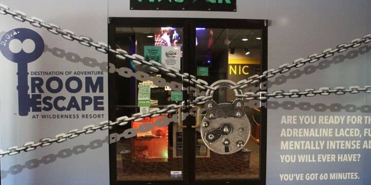 Large pad lock graphic in front of an entrance.