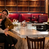 A couple having drinks at the bar.