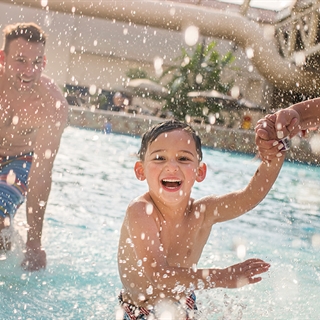 Family at Wilderness Dome wave pool.