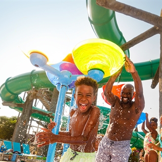Father and son playing at Wilderness waterpark.
