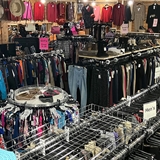 Clothing section at a thrift store.