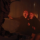 Scared couple in front of a monster.