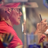 A man working on a new glass art piece.