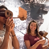 A girl uses an interactive exhibit to learn more about Wisconsin Dells history.
