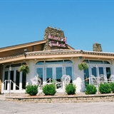 House of Embers exterior with greenery.