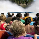 A jet boat splashing through the water.