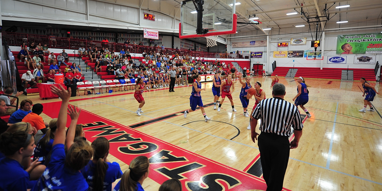 People watch a basketball game at the JustAGame Fieldhouse.