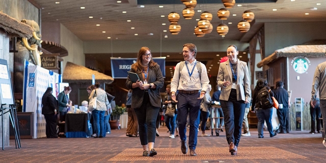 Business people walking inside Kalahari Convention Center.