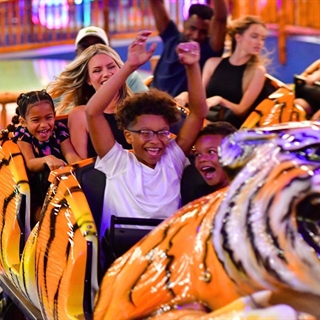 Families riding tiger roller coaster.