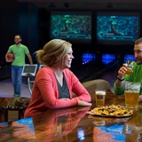 People enjoying appetizers and drinks.