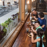 A family enjoying a meal at MACS in downtown Wisconsin Dells.