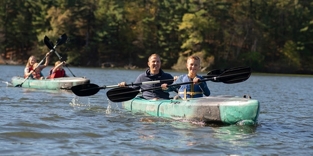 A family kayaks in Wisconsin Dells.