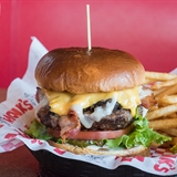 A cheeseburger, fries, and milkshake from Monk's Bar & Grill at the Wilderness.