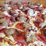 A cheeseburger, fries, and a beer.