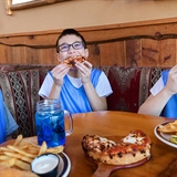 A group of boys having food.