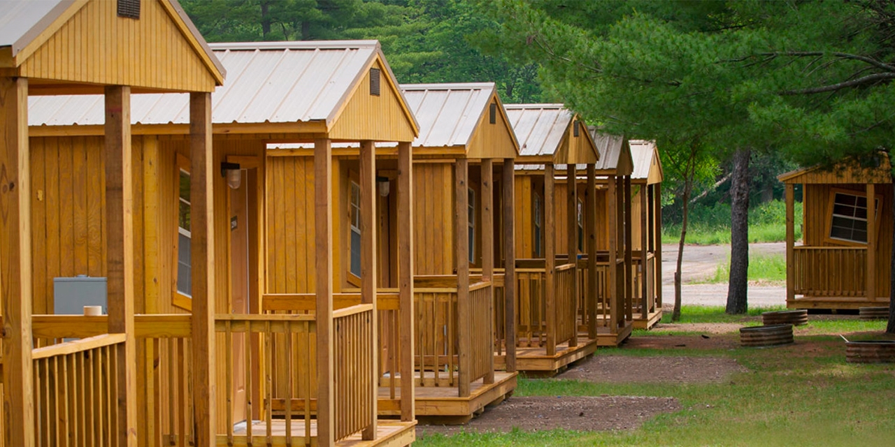 Cabins and trees at Mt. Olympus Camp Resort.