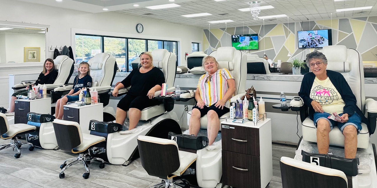 Ladies sitting on spa chairs.