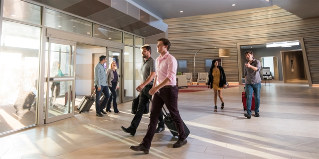 Business people walking at the Ho-Chunk Hotel lobby.