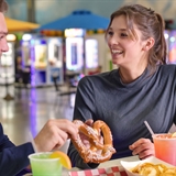 Two adults sitting at the table.