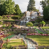 A waterfall going through the mini-golf course.