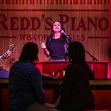 Musicians perform for guests at Redd's Piano Bar.